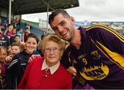 22 August 2015; Tony French, Wexford, celebrates with his grandmother Katie Crean after the game. Bord Gáis Energy GAA Hurling All Ireland U21 Championship, Semi-Final, Wexford v Antrim. Semple Stadium, Thurles, Co. Tipperary. Picture credit: Ray McManus / SPORTSFILE