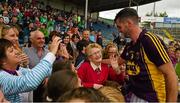 22 August 2015; Tony French, Wexford, celebrates with his mother Anne, left, and his grandmother Katie Crean  after the game.  Bord Gáis Energy GAA Hurling All Ireland U21 Championship, Semi-Final, Wexford v Antrim. Semple Stadium, Thurles, Co. Tipperary. Picture credit: Ray McManus / SPORTSFILE