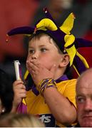 22 August 2015; Seven year old Wexford supporter Cian McCormack, from Screen, watches the game. Bord Gáis Energy GAA Hurling All Ireland U21 Championship, Semi-Final, Wexford v Antrim. Semple Stadium, Thurles, Co. Tipperary. Picture credit: Ray McManus / SPORTSFILE