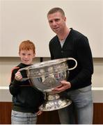 22 August 2015; Kerry legend Tomás Ó Sé with his son Michéal and the Sam Maguire Cup at today's Bord Gáis Energy Legends Tour at Croke Park, where he relived some of most memorable moments from his playing career. All Bord Gáis Energy Legends Tours include a trip to the GAA Museum, which is home to many exclusive exhibits, including the official GAA Hall of Fame. For booking and ticket information about the GAA legends for this summer visit www.crokepark.ie/gaa-museum. Croke Park, Dublin. Picture credit: Brendan Moran / SPORTSFILE