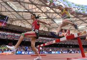 24 August 2015; Hanane Ouhaddou of Morocco and Madeline Heiner of Australia during the Women's 3000m Steeplechase heats. IAAF World Athletics Championships Beijing 2015 - Day 3, National Stadium, Beijing, China. Picture credit: Stephen McCarthy / SPORTSFILE