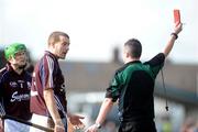 15 February 2009; Referee James McGrath shows Galway fullback Damien McClearn a straight red card. Allianz National Hurling League, Division 1, Round 2, Dublin v Galway, Parnell Park, Dublin. Picture credit: Daire Brennan / SPORTSFILE
