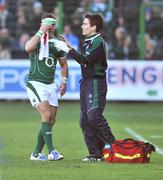 15 February 2009; Ireland's Paddy Wallace leaves the pitch with a blood injury in the company of team doctor Dr. Gary O'Driscoll. RBS Six Nations Championship, Italy v Ireland, Stadio Flaminio, Rome, Italy. Picture credit: Brendan Moran / SPORTSFILE