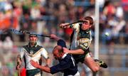 15 October 2000; Charlie Carter of Ireland in action against Dan McRae of Scotland during the Hurling Shinty International match between Ireland and Scotland at Croke Park in Dublin. Photo by Brendan Moran/Sportsfile
