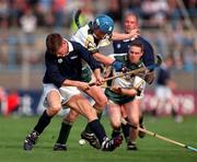 15 October 2000; Norman Campbell of Scotland in action against Ollie Canning of Ireland during the Hurling Shinty International match between Ireland and Scotland at Croke Park in Dublin. Photo by Brendan Moran/Sportsfile