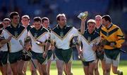 15 October 2000; Ireland captain DJ Carey and team-mates celebrate with the cup folloowing his side's victory during the Hurling Shinty International match between Ireland and Scotland at Croke Park in Dublin. Photo by Ray McManus/Sportsfile