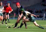 15 October 2000; Ronald Ross of Scotland in action against Ollie Moran of Ireland during the Hurling Shinty International match between Ireland and Scotland at Croke Park in Dublin. Photo by Ray McManus/Sportsfile