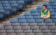 15 October 2000; An Ireland fan wearing a Offaly jersey watches on during the Hurling Shinty International match between Ireland and Scotland at Croke Park in Dublin. Photo by Brendan Moran/Sportsfile
