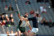 15 October 2000; DJ Carey of Ireland in action against Ian Borthwick of Scotland during the Hurling Shinty International match between Ireland and Scotland at Croke Park in Dublin. Photo by Brendan Moran/Sportsfile