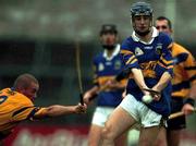 22 October 2000; Paul Kelly of Tipperary in action against Alan Markham of Clare during the Waterford Crystal South East Hurling League match between Clare and Tipperary at Cusack Park in Ennis, Clare. Photo by Brendan Moran/Sportsfile