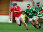 22 October 2000; Austin Walsh of Cork breaks away from Clement Smith of Limerick during the Waterford Crystal South East Hurling League match between Limerick and Cork at Gaelic Grounds in Limerick. Photo by Damien Eagers/Sportsfile