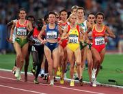 22 September 2000; Gabriela Szabo of Romania, yellow, leads the field on her way to winning the third heat of the Women's 5000m at Stadium Australia in the Sydney Olympic Park in Homebush Bay, Sydney, Australia. Photo by Brendan Moran/Sportsfile