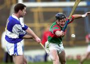 4 November 2000; John O'Sullivan of Castletown has his shot blocked by Brian Whelahan of Birr during the AIB Leinster Club Hurling Championship Quarter-Final match between Castletown and Birr at O'Moore Park in Portlaoise, Laois. Photo by Ray McManus/Sportsfile