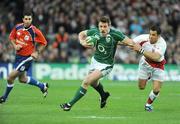 28 February 2009; Tommy Bowe, Ireland, breaks through the tackle of Riki Flutey, England. RBS Six Nations Rugby Championship, Ireland v England, Croke Park, Dublin. Picture credit: Brendan Moran / SPORTSFILE