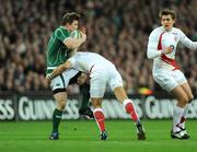 28 February 2009; Brian O'Driscoll, Ireland, in action against Riki Flutey, England. RBS Six Nations Rugby Championship, Ireland v England, Croke Park, Dublin. Picture credit: Pat Murphy / SPORTSFILE *** Local Caption ***