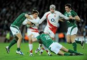 28 February 2009; Toby Flood, England, is tackled by Paddy Wallace, left, and Ronan O'Gara, Ireland. RBS Six Nations Rugby Championship, Ireland v England, Croke Park, Dublin. Picture credit: Brendan Moran / SPORTSFILE