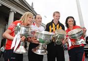 2 March 2009; The St. Patrick's Festival today made the official announcement of the St. Patrick's Festival Grand Marshals for 2009. Pictured at the announcement are Grand Marshal's, from left, Cork football captain Angela Walsh, with the Brendan Martin Cup, Tyrone captain Brian Dooher, with the Sam Maguire Cup, Kilkenny captain Henry Shefflin, with the Liam MacCarthy Cup, and Cork camogie captain Cathriona Foley, with the O'Duffy Cup. O'Connell Street, Dublin. Picture credit: Stephen McCarthy / SPORTSFILE