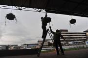 9 March 2009; Course staff hang a basket of flowers at Prestbury Park ahead of the 2009 Cheltenham Festival. Cheltenham Racing Festival, Prestbury Park, Cheltenham, England. Picture credit: David Maher / SPORTSFILE