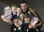 10 March 2009; “School tour with your GAA hero”: Kerry footballer Kieran Donaghy with nine-year-old Seán Mac Tomáis, from Gaelscoil Thulach na Nóg, Dúnbúinne, John Mitchell, 9 years, Dunboyne Senior Primary School, and five-year-old twins Poppy and Alex Conroy, from St Patrick's National School, Diswellstown, Castlknock, Dublin, brandishing photographs of their GAA heroes at a photocall to launch a new initiative.  The competition, which is open to all primary school children, will allow the winner to bring their class on a GAA Museum and Croke Park Stadium Tour.  For details visit www.crokepark.ie or email gaamuseum@crokepark.ie - GAA Museum, Croke Park, Dublin. Picture credit: Ray McManus / SPORTSFILE