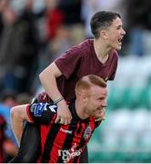 5 September 2015; A young supporter jumps on the back of Bohemians' Lorcan Fitzgerald after the final whistle. SSE Airtricity League Premier Division, Shamrock Rovers v Bohemians. Tallaght Stadium, Tallaght, Co. Dublin. Picture credit: Seb Daly / SPORTSFILE
