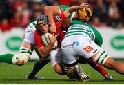 5 September 2015; Duncan Williams, Munster, is tackled by Duncan Naudé and Tom Palmer, Benetton Treviso. Guinness PRO12 Round 1, Munster v Benetton Treviso. Irish Independent Park, Cork. Picture credit: Eoin Noonan / SPORTSFILE