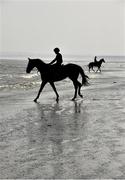 10 September 2015; A general view of jockeys and horses on the beach before the races begin. Laytown Races, Laytown, Co. Meath. Picture credit: Cody Glenn / SPORTSFILE