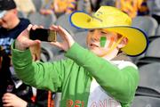 17 March 2009; Ten-year-old Eoin Campbell, from Ballymena, Co. Antrim, supporting Portumna, records a scene on his camera phone. AIB All-Ireland Senior Club Hurling Championship Final, Portumna, Co. Galway, v De La Salle, Waterford, Croke Park, Dublin. Picture credit: Ray McManus / SPORTSFILE