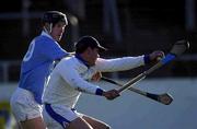 26 November 2000; Castletown keeper John Lyons clears under pressure from Denis Byrne of Graigue Ballycallan during the AIB Leinster Senior Hurling Championship Final between Graigue Ballycallan and University College Dublin at Nowlan Park in Kilkenny. Photo by Ray McManus/Sportsfile