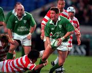 11 November 2000; Ronan O'Gara of Ireland in action against Toshikazu Fumihara of Japan during the International Rugby friendly match between Ireland and Japan at Lansdowne Road in Dublin. Photo by Ray Lohan/Sportsfile