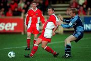 12 November 2000; Paul Byrne of St Patricks Athletic in action against Michael O'Donnell of UCD during the Eircom League Premier Division match between St Patricks Athletic and University College Dublin at Belfield in Dublin. Photo by Pat Murphy/Sportsfile