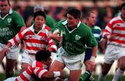 11 November 2000; Ronan O'Gara of Ireland is tackled by Michinori Oda of Japan during the International Rugby friendly match between Ireland and Japan at Lansdowne Road in Dublin. Photo by Ray Lohan/Sportsfile