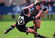 9 December 2000; James Ferris of Blackrock College is tackled by Ajay Derwin of Ballymena during the AIB Ireland League Divison One match between Blackrock College and Ballymena at Stradbrook Road in Dublin. Photo by Aoife Rice/Sportsfile