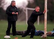 11 December 2000; Scrum-half Peter Stringer, right, does some stretching exercises under the watchful eye of coach Warren Gatland during Irish rugby squad training at the ALSAA Club in Dublin. Photo by Brendan Moran/Sportsfile