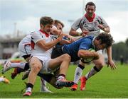 12 September 2015; Caelan Doris, Leinster captain, goes through the tackles of Ben Finlay, left, and Jonathon Stewart, behind, Ulster, as he scores his team's second try. Schools Interprovincial Rugby Championship, Round 2, Ulster v Leinster, Belfast Harlequins RFC, Deramore Park, Belfast, Co. Antrim. Picture credit: Seb Daly / SPORTSFILE
