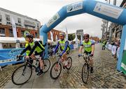 13 September 2015; The Irish Sports Council, in conjunction with Cycling Ireland teamed up with the Department of Transport, Tourism and Sport, Dublin City Council and Healthy Ireland for the Great Dublin Bike Ride which seen over 3,000 participants of all abilities from novice to expert ride 60km or 100km routes. Pictured is a general view of participants as they cycle under the finish banner. The Great Dublin Bike Ride. Smithfield Square, Dublin. Picture credit: Seb Daly / SPORTSFILE