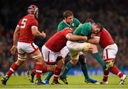 19 September 2015; Peter O'Mahony, Ireland, is tackled by Doug Wooldridge, left, and Aaron Carpenter, Canada. 2015 Rugby World Cup, Pool D, Ireland v Canada. Millennium Stadium, Cardiff, Wales. Picture credit: Stephen McCarthy / SPORTSFILE