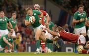 19 September 2015; Ian Madigan, Ireland,  is tackled by Brett Beukeboom, Canada. 2015 Rugby World Cup, Pool D, Ireland v Canada. Millennium Stadium, Cardiff, Wales. Picture credit: Brendan Moran / SPORTSFILE