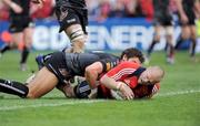 12 April 2009; Paul Warwick, Munster, scores his side's first try despite the tackle of James Hook, Neath Swansea Ospreys. Heineken Cup Quarter-Final, Munster v Neath Swansea Ospreys, Thomond Park, Limerick. Picture credit: Brendan Moran / SPORTSFILE *** Local Caption ***