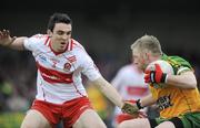 12 April 2009; Brian Roper, Donegal, in action against Kevin McGuckin, Derry. Allianz GAA National Football League, Division 1, Round 7, Derry v Donegal, Maghera, Co. Derry. Picture credit: Oliver McVeigh / SPORTSFILE *** Local Caption ***