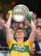 20 September 2015; Billy Courtney, Kerry, lifts the Tom Markham Cup. Electric Ireland GAA Football All-Ireland Minor Championship Final, Kerry v Tipperary, Croke Park, Dublin. Picture credit: Stephen McCarthy / SPORTSFILE