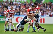 23 September 2015; Luke Thompson, Japan, is tackled by Grant Gilchrist, left, and Jonny Gray, Scotland. 2015 Rugby World Cup, Pool B, Scotland v Japan. Kingsholm Stadium, Gloucester, England. Picture credit: Ramsey Cardy / SPORTSFILE