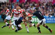 23 September 2015; Michael Broadhurst, Japan, is tackled by Ryan Wilson, left, and Alasdair Dickinson, Scotland. 2015 Rugby World Cup, Pool B, Scotland v Japan. Kingsholm Stadium, Gloucester, England. Picture credit: Ramsey Cardy / SPORTSFILE