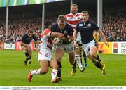 23 September 2015; Stuart Hogg, Scotland, is tackled by Fumiaki Tanaka, Japan. 2015 Rugby World Cup, Pool B, Scotland v Japan. Kingsholm Stadium, Gloucester, England. Picture credit: Ramsey Cardy / SPORTSFILE