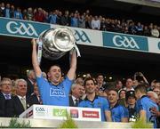 20 September 2015; Cormac Costello, Dublin, lifts the Sam Maguire after the game. GAA Football All-Ireland Senior Championship Final, Dublin v Kerry, Croke Park, Dublin. Picture credit: Ray McManus / SPORTSFILE