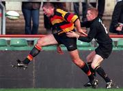 16 December 2000; Colin McEntee of Lansdowne RFC is tackled by Mike Predergast of Young Munster RFC during the AIB All-Ireland League Division 1 match between Lansdowne RFC and Young Munster RFC at Lansdowne Road in Dublin. Photo by Brendan Moran/Sportsfile