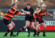 16 December 2000; Mick Lynch of Young Munster RFC is tackled by Aidan McCullen, 7, and Ollie Ennis, right, of Lansdowne RFC during the AIB All-Ireland League Division 1 match between Lansdowne RFC and Young Munster RFC at Lansdowne Road in Dublin. Photo by Brendan Moran/Sportsfile