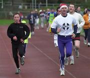 25 December 2000; Former World 5000 meters champion, Eamonn Coghlan and his son John during the Annual Goal Mile at Belfield in Dublin. Photo by Ray McManus/Sportsfile