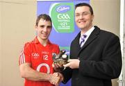 4 May 2009; Cork's Colm O'Driscoll is presented Cadbury Hero of the Match Award by Cadbury Senior Brand manager Shane Guest. Cadbury Under 21 All-Ireland Football Championship Final, Cork v Down, O'Moore Park, Portlaoise, Co. Laois. Picture credit: David Maher / SPORTSFILE