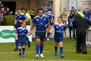 3 October 2015; Matchday mascots Paddy Owens, age 8, from Meath, left, and Cody Denton, age 10, from Wexford, lead the Leinster team out with captain Isa Nacewa ahead of the Guinness PRO12, Round 3, clash between Leinster and Newport Gwent Dragons at the RDS, Ballsbridge, Dublin. Picture credit: Stephen McCarthy / SPORTSFILE