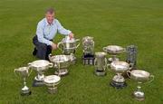 6 May 2009; Rackard Cody with the Hurling trophies won by Kilkenny hurling teams in 2008/9, from left, Leinster Under 21 trophy, Leinster Minor trophy, Leinster Intermediate trophy, National Hurling League Division 1 trophy, Bob O'Keeffe Cup, Liam MacCarthy Cup, Irish Press Cup, All-Ireland Intermediate trophy, Walsh Cup, All-Ireland Under 21 trophy and the Railway Cup. Picture credit: Brendan Moran / SPORTSFILE